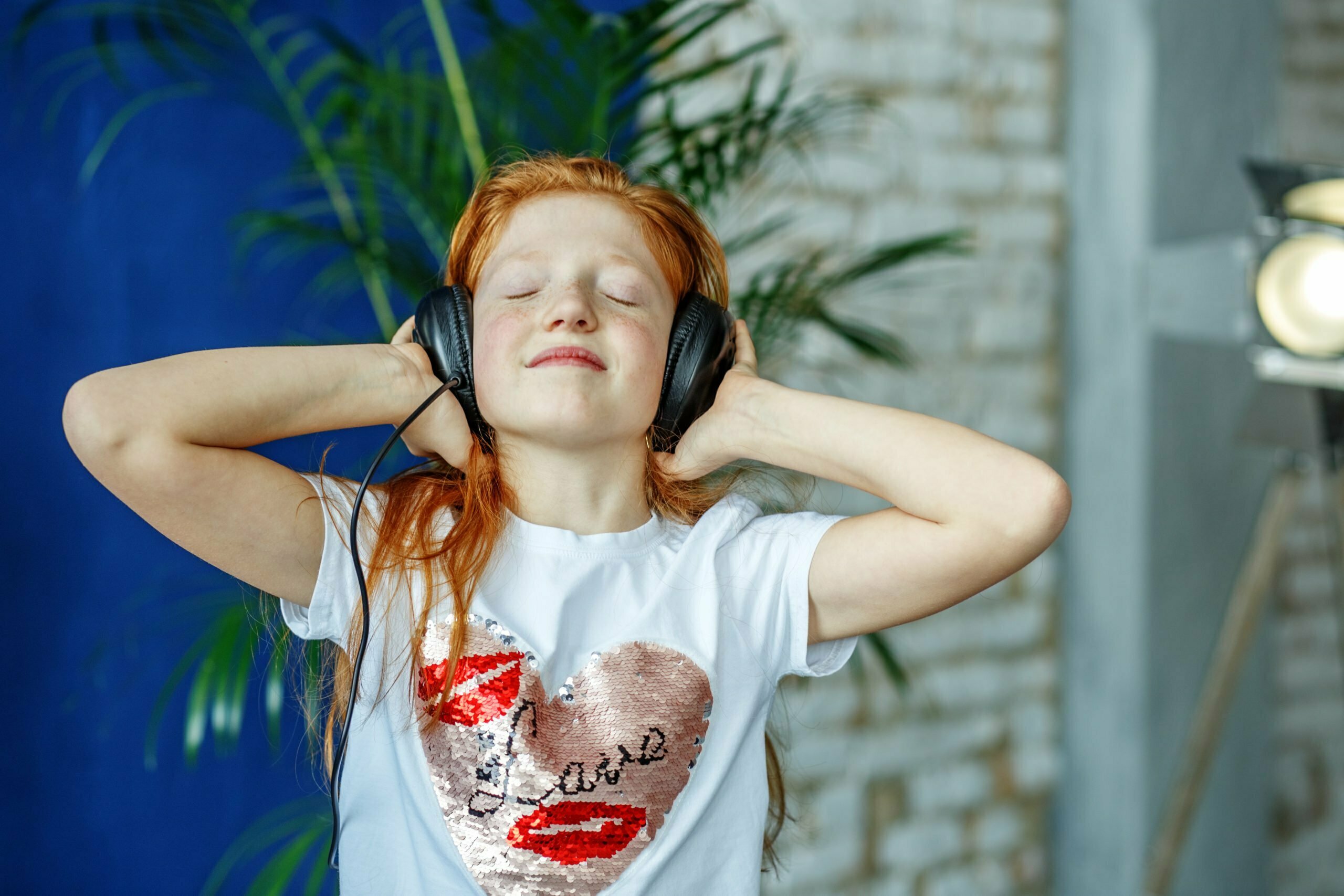 an emotional child listens to songs in the headpho       utc scaled